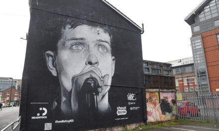Outrage Across Manchester as Ian Curtis Mural is Replaced by Aitch’s Album Advertisement